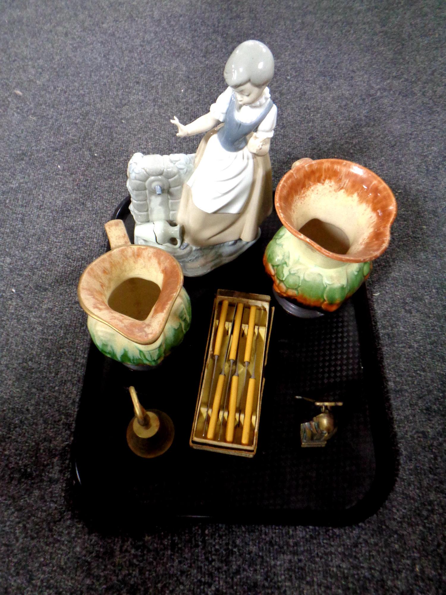 A tray of miscellania : Nao figure (as found), two West German jugs, brass door knocker, hand bell,