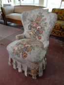 A 20th century bedroom chair upholstered in a floral fabric