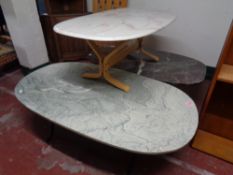 Three oval composite topped tables on pedestals