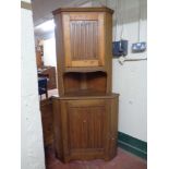 A 20th century pine double door corner cabinet