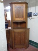 A 20th century pine double door corner cabinet