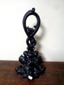 An antique cast iron door stop