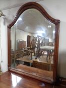 An antique mahogany arch topped bevel edged overmantel mirror, width 90 cm,