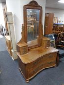 A late 19th century serpentine fronted dressing table, width 115 cm,