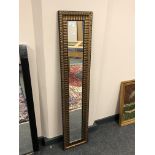 A narrow contemporary mirror,