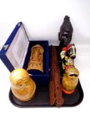 A tray containing wooden tourist pieces to include Babushka dolls,