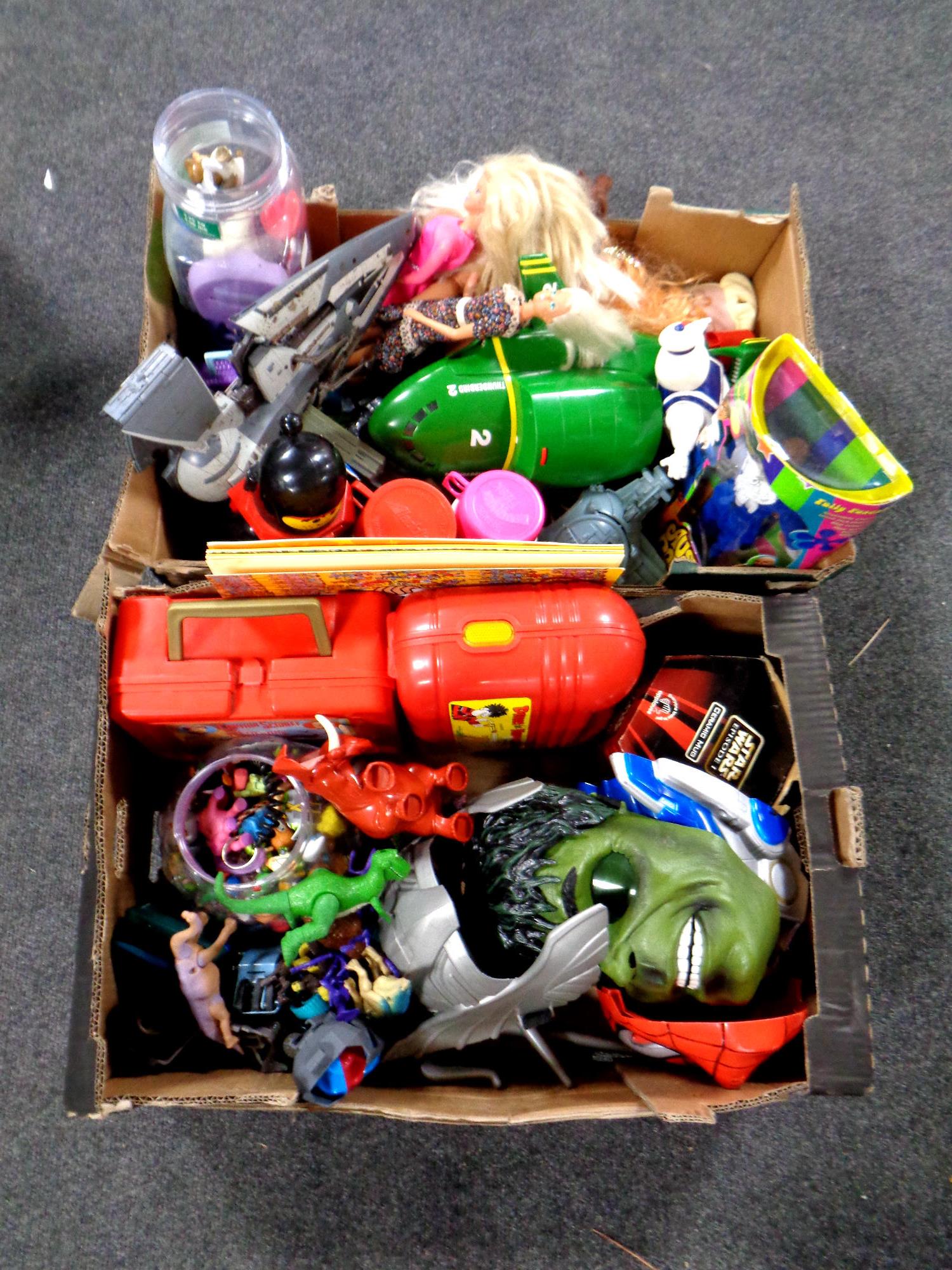 Two boxes containing assorted toys to include Thunderbird 2, dolls, a Captain Scarlett lunch box,