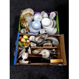 Two boxes containing miscellaneous to include stainless steel cutlery, picture frames,