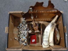 A box containing three cow horns, wooden elephant ornament, trinket box,