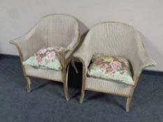 Two 20th century painted loom armchairs with floral cushions