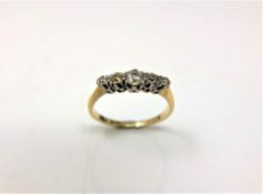 An 18ct gold and platinum five stone old-cut diamond ring, size O.