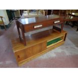 A 20th century Danish low table fitted two drawers together with a sliding door unit