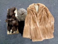 A box containing fur coat (as found), a fox fur wrap,