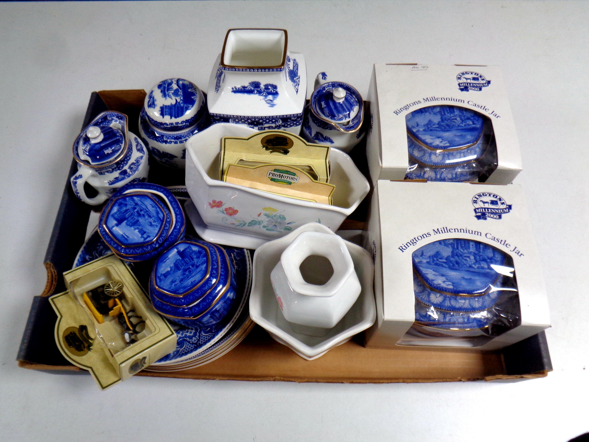 A box containing a quantity of boxed and unboxed Ringtons ceramics to include tea caddies,