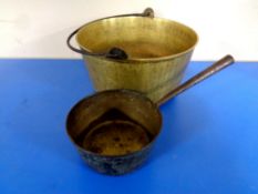 An antique brass cast iron handled jam pan together with a further saucepan