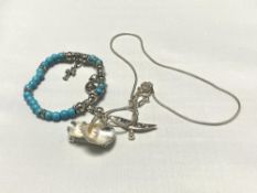 A costume necklace and chain set with turquoise coloured stones