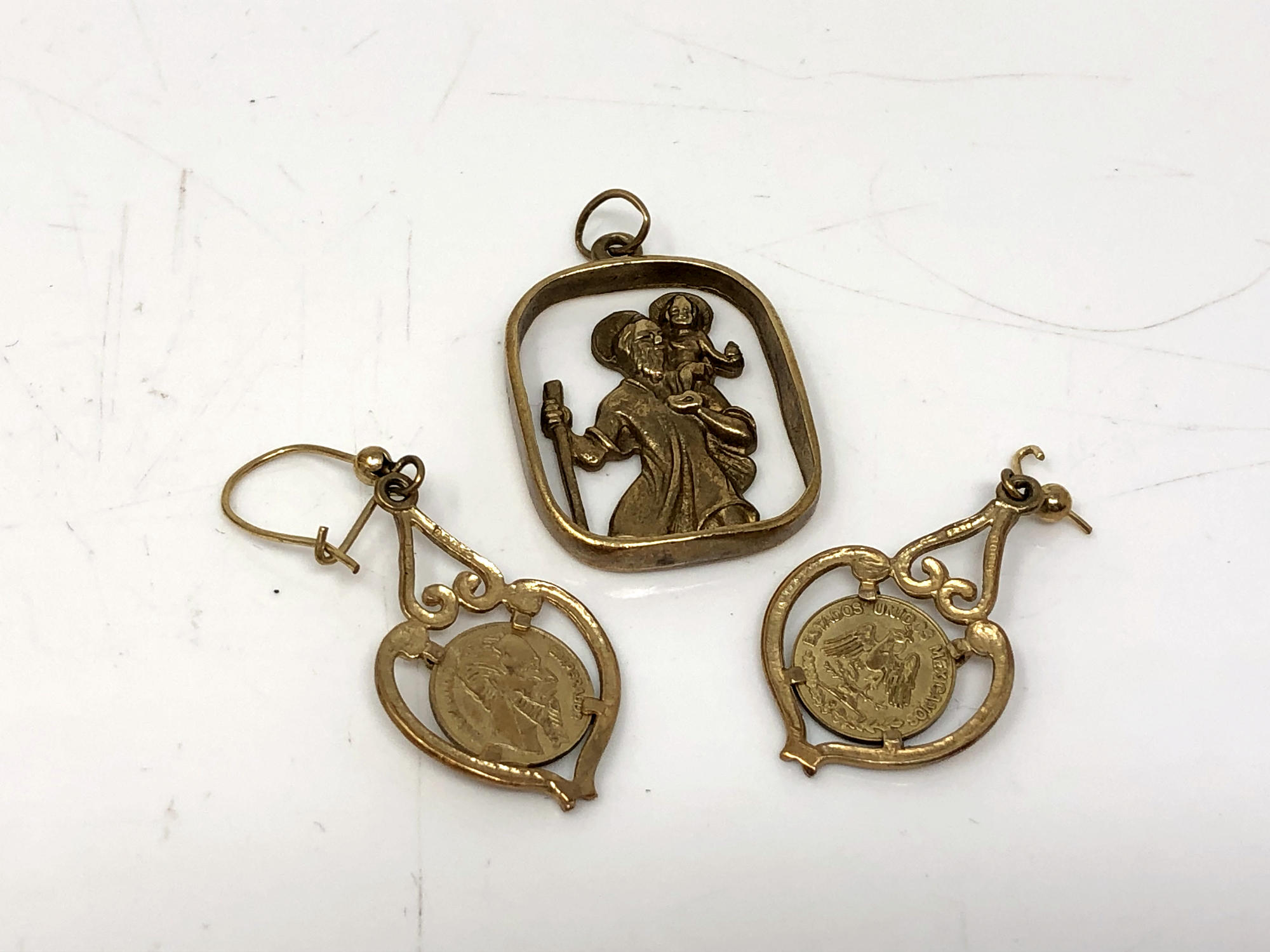 A pair of 9ct gold coin inset earrings (a/f), together with a 9ct gold St Christopher.