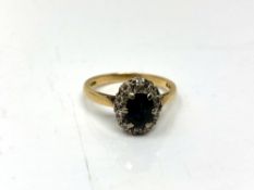 An 18ct gold sapphire and diamond ring, size O. CONDITION REPORT: 3.