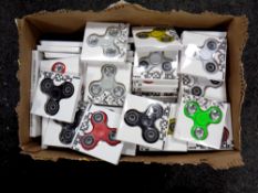 A box containing a large quantity of fidget spinners