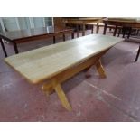 A blonde oak refectory coffee table