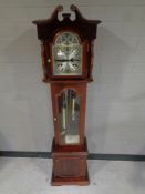 A Highlands Tempus Fugit granddaughter clock with pendulum, key and weights,