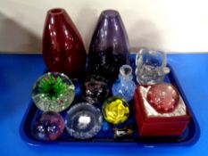 A tray containing assorted glassware to include Marks and Spencer's vases, paperweights,