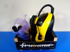 A Little Yello steam cleaner with accessories