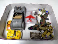A box containing assorted die cast military aircraft and cars