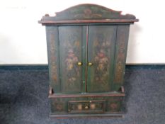 An antique hand painted pine double door wall cabinet fitted a drawer