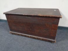 An antique scumbled pine blanket box