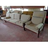 A Scandinavian 1970s rosewood framed three piece lounge suite upholstered in a beige fabric