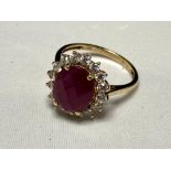 A 9ct gold ruby and cubic zirconia cluster ring