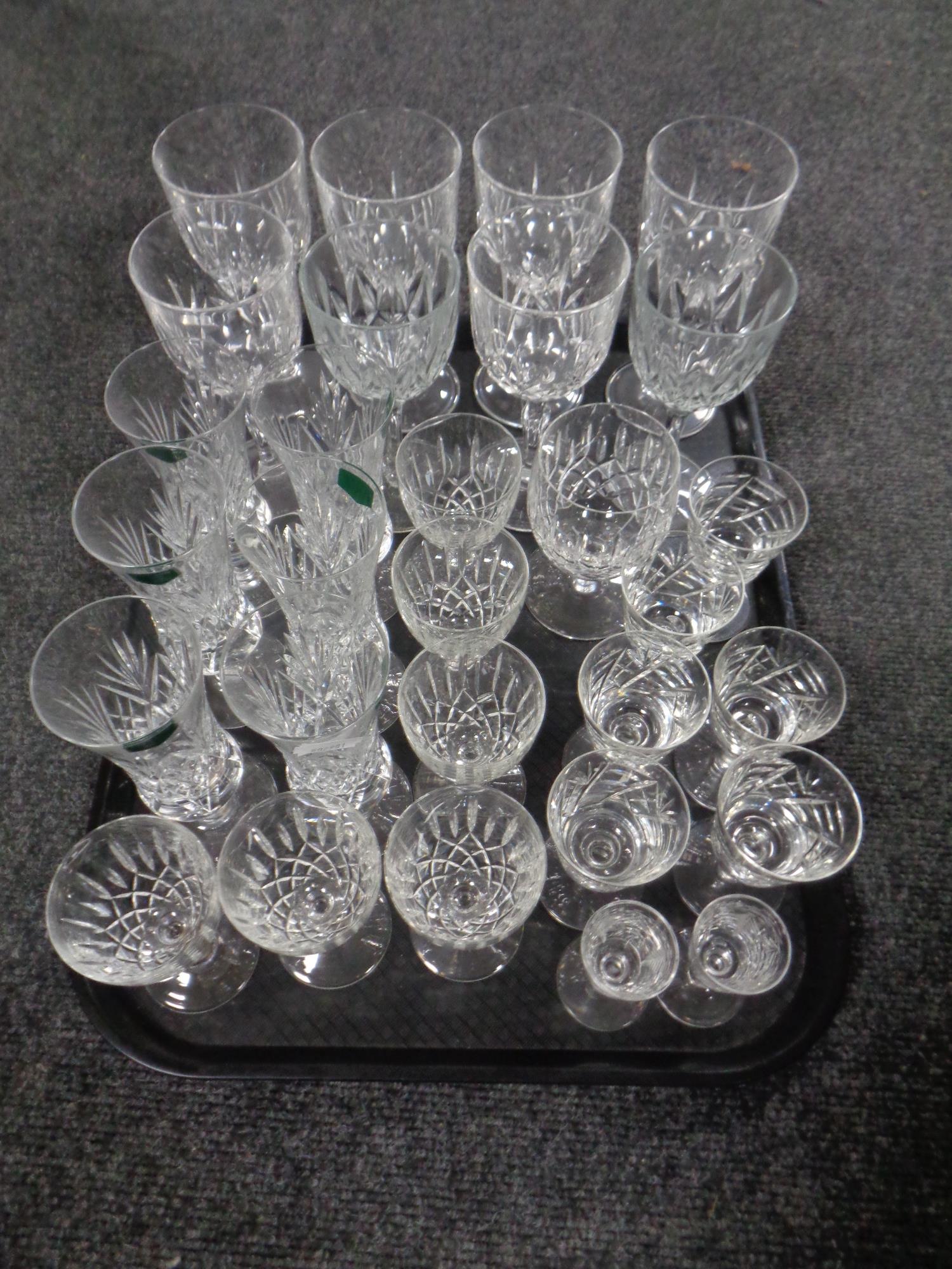 A tray containing lead crystal drinking glasses to include a set of six West Country champagne