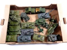 A box containing a quantity of die cast tanks and military vehicles by Ertl and Dinky