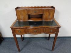 A Victorian style mahogany lady's writing desk with a green tooled leather inset panel, width 94 cm,