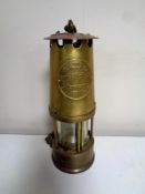 A brass Eccles protector miner's lamp