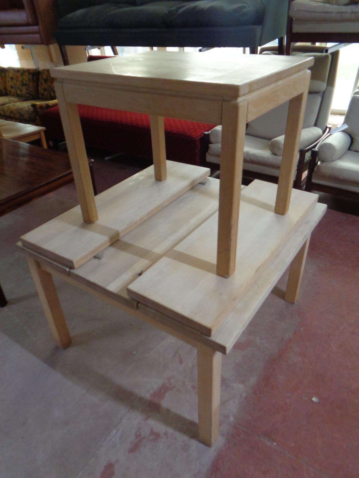 A blonde oak lamp table together with a heavy pine flap sided coffee table