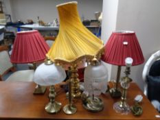 Seven assorted brass table lamps,