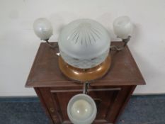 A copper Art Deco three way light fitting with glass shades