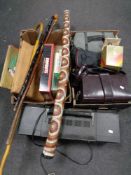 Two boxes containing miscellaneous to include video cameras, board games, games compendium,