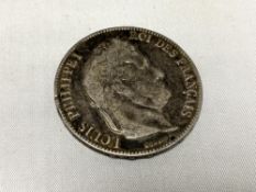 An 1857 silver five franc coin