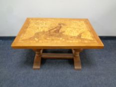 An oak mosaic topped refectory coffee table on bulbous legs