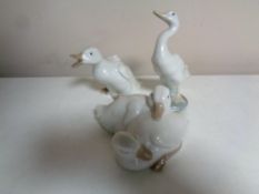 A Lladro figure of a duck together with two further Nao figures,