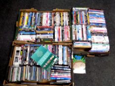Three boxes containing assorted DVDs and CDs to include children's movies