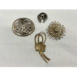 Four silver brooches