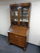 An Edwardian oak bureau bookcase,