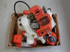 A box containing five petrol brush cutter engines