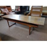 A mid 20th century Danish rosewood coffee table with under shelf,