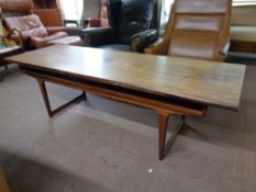 A mid 20th century Danish rosewood coffee table with under shelf,