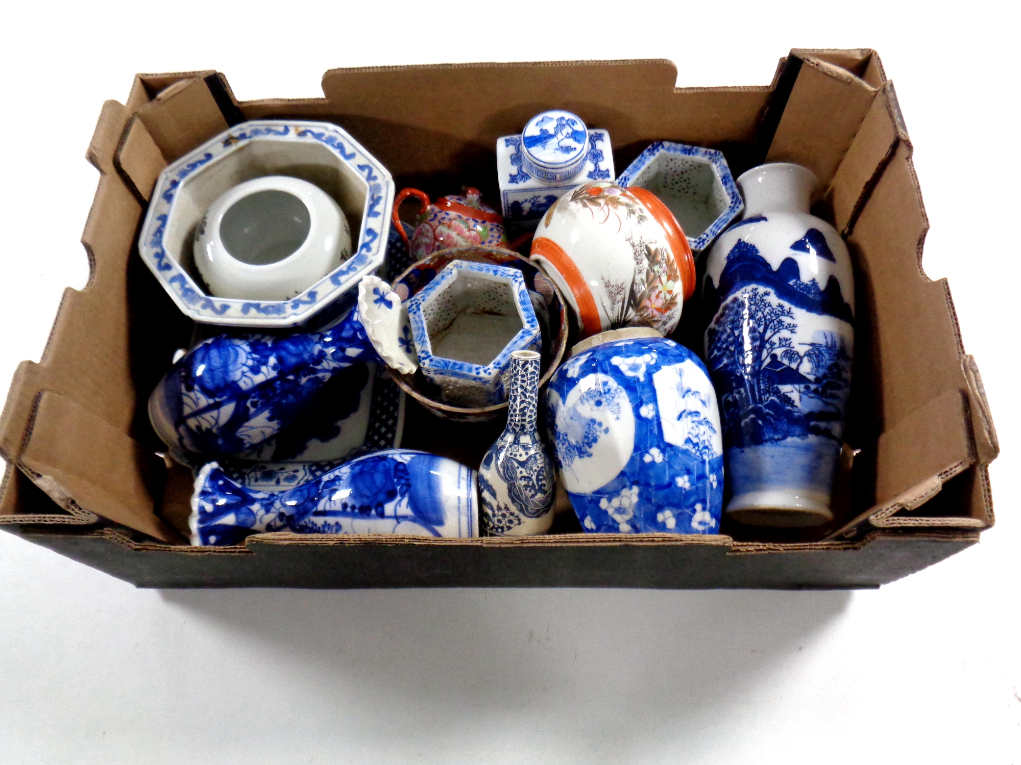 A box containing antique and later oriental wares to include vases, teapot,